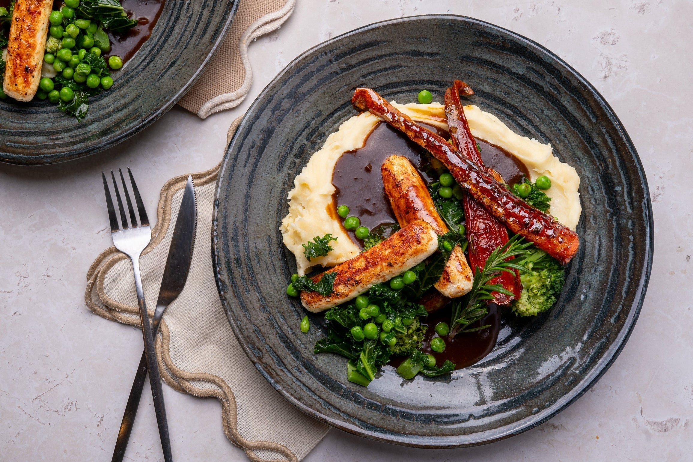 Chicken Cumberland Sausages with Creamy Mash, Rich Onion Gravy & Honey-Roasted Carrots