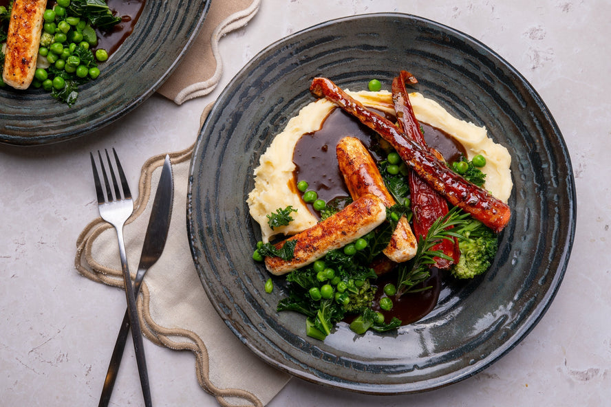 Chicken Cumberland Sausages with Creamy Mash, Rich Onion Gravy & Honey-Roasted Carrots