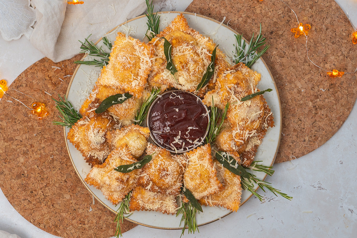 Crispy Ravioli stuffed with HECK Simply Chicken Mince, Sage & Brie, served with Cranberry Ketchup